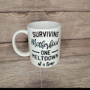 Surviving motherhood skull coffee mug